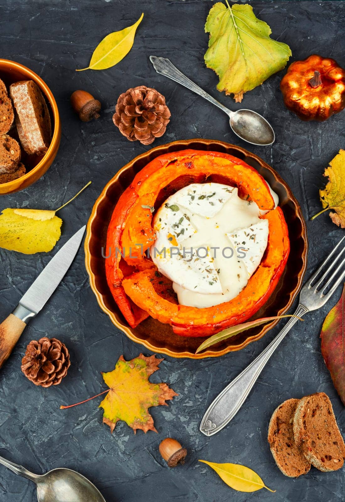 Halved roasted squash filled with spicy and camembert cheese.