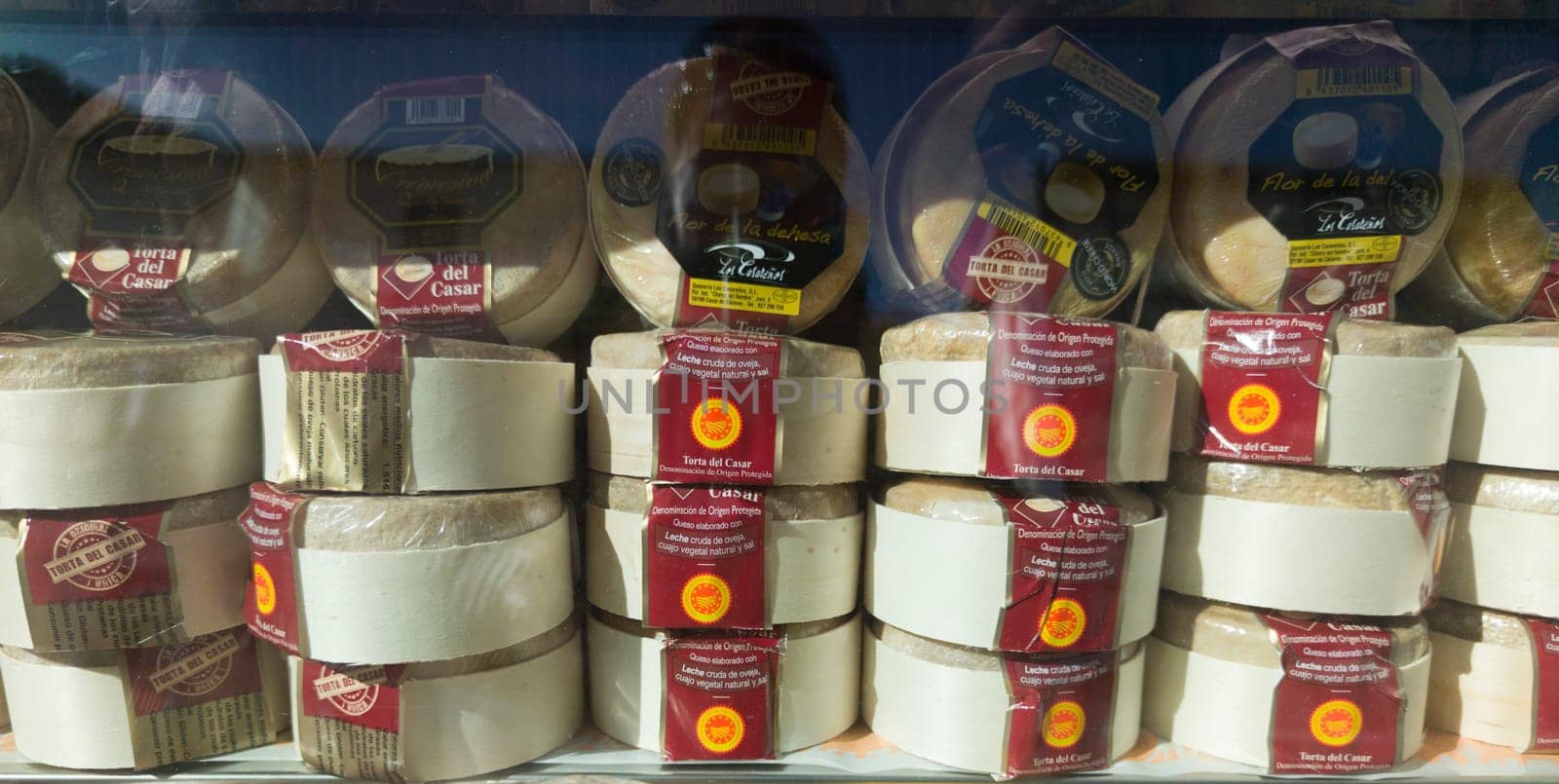 Caceres, Spain - Feb 14th, 2023: Torta del Casar cheeses displayed in a shop window