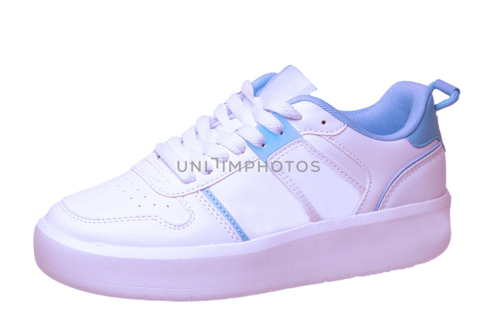 White sneakers isolated. Close-up of a single white elegant stylish leather sport shoe isolated on white background. Modern design footwear for workout. Macro.