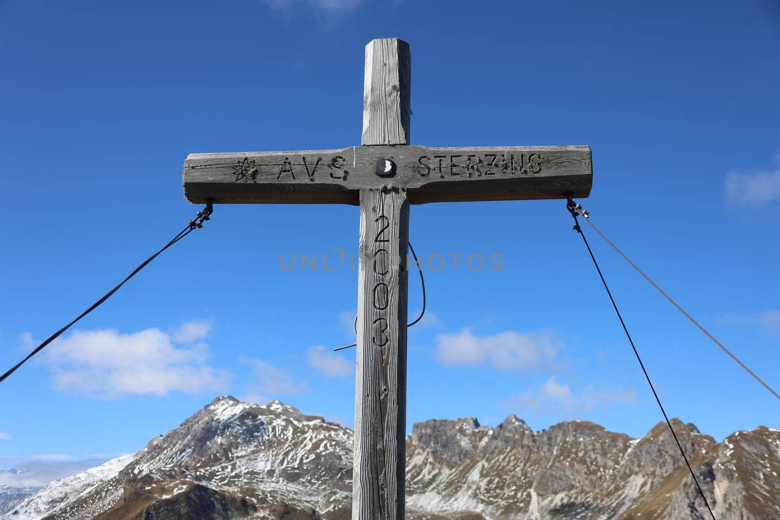 Summit cross on the Monte Cavallo at 2,166 metres above sea level above Vipiteno in the hiking paradise and holiday region of South Tyrol / Alto Adige