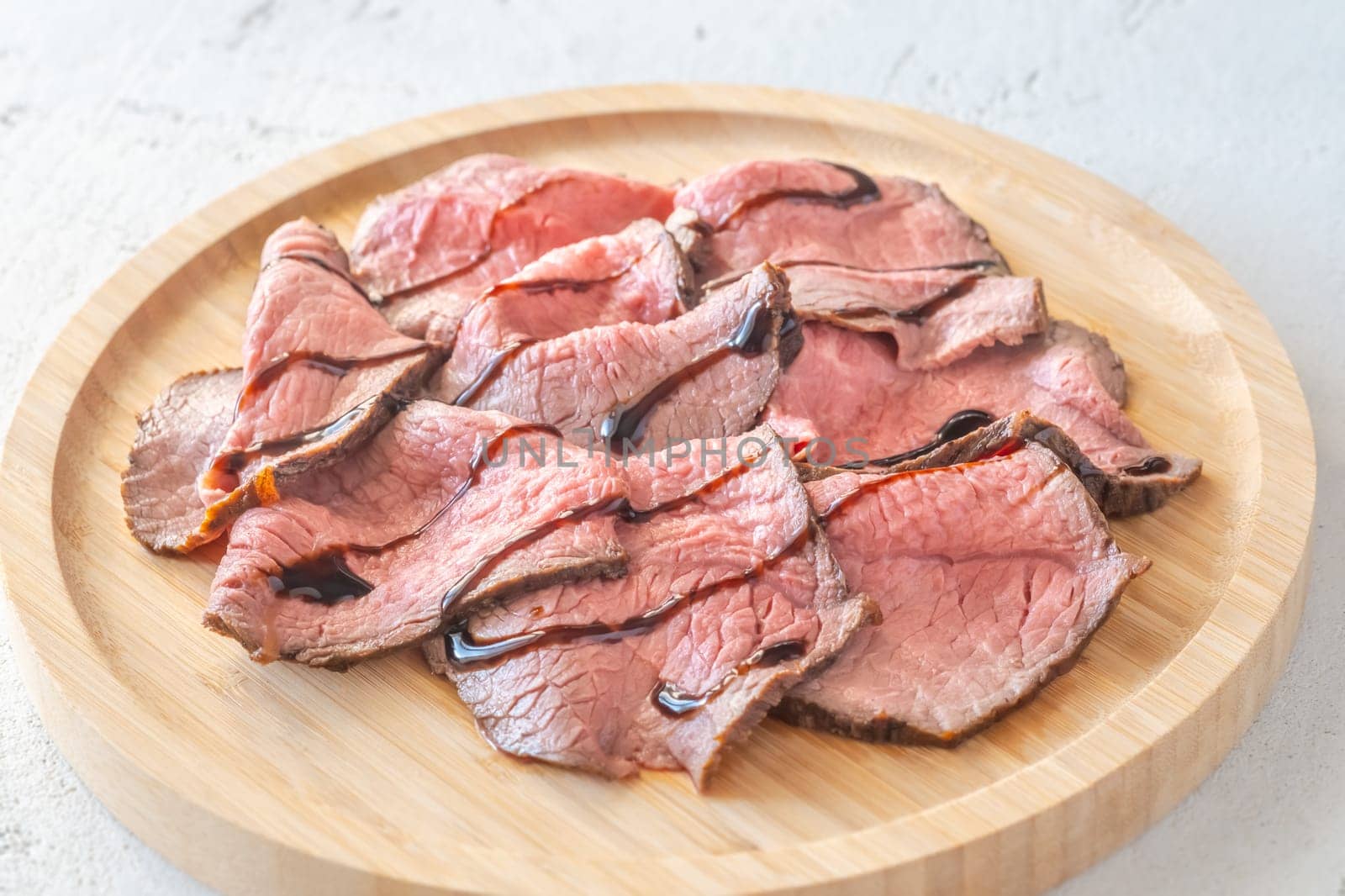 Portion of sliced roast beef on the plate