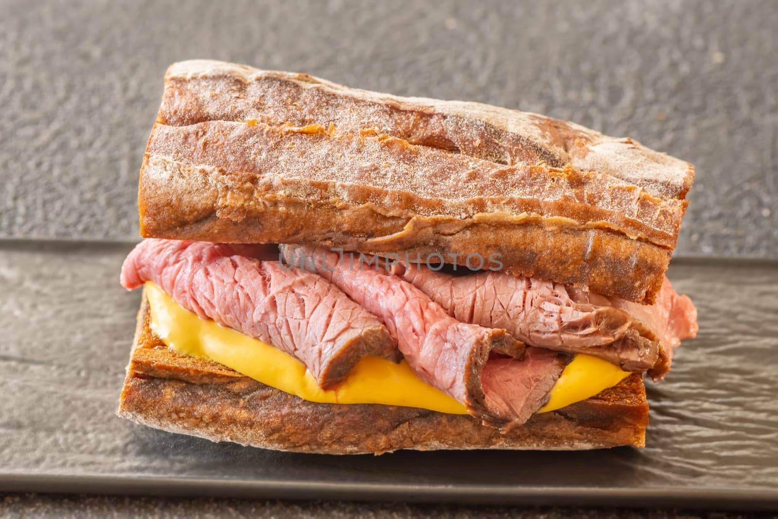 Sandwich with sliced roast beef and cheese