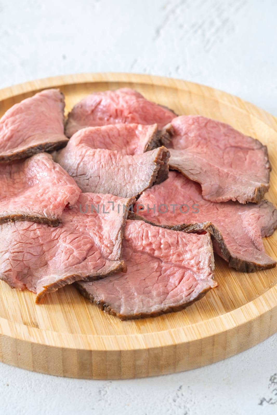 Portion of sliced roast beef on the plate