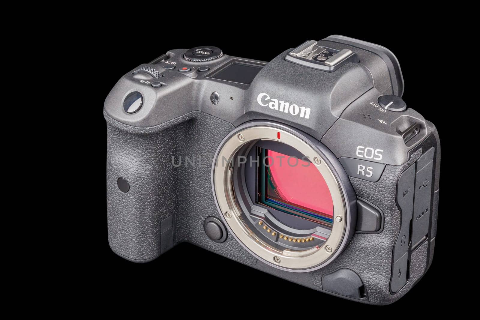 Canon R5 - black professional 35mm full-frame mirrorless camera body with flip screen isolated on black background with focus stacking - Tula, Russia, September 15, 2021