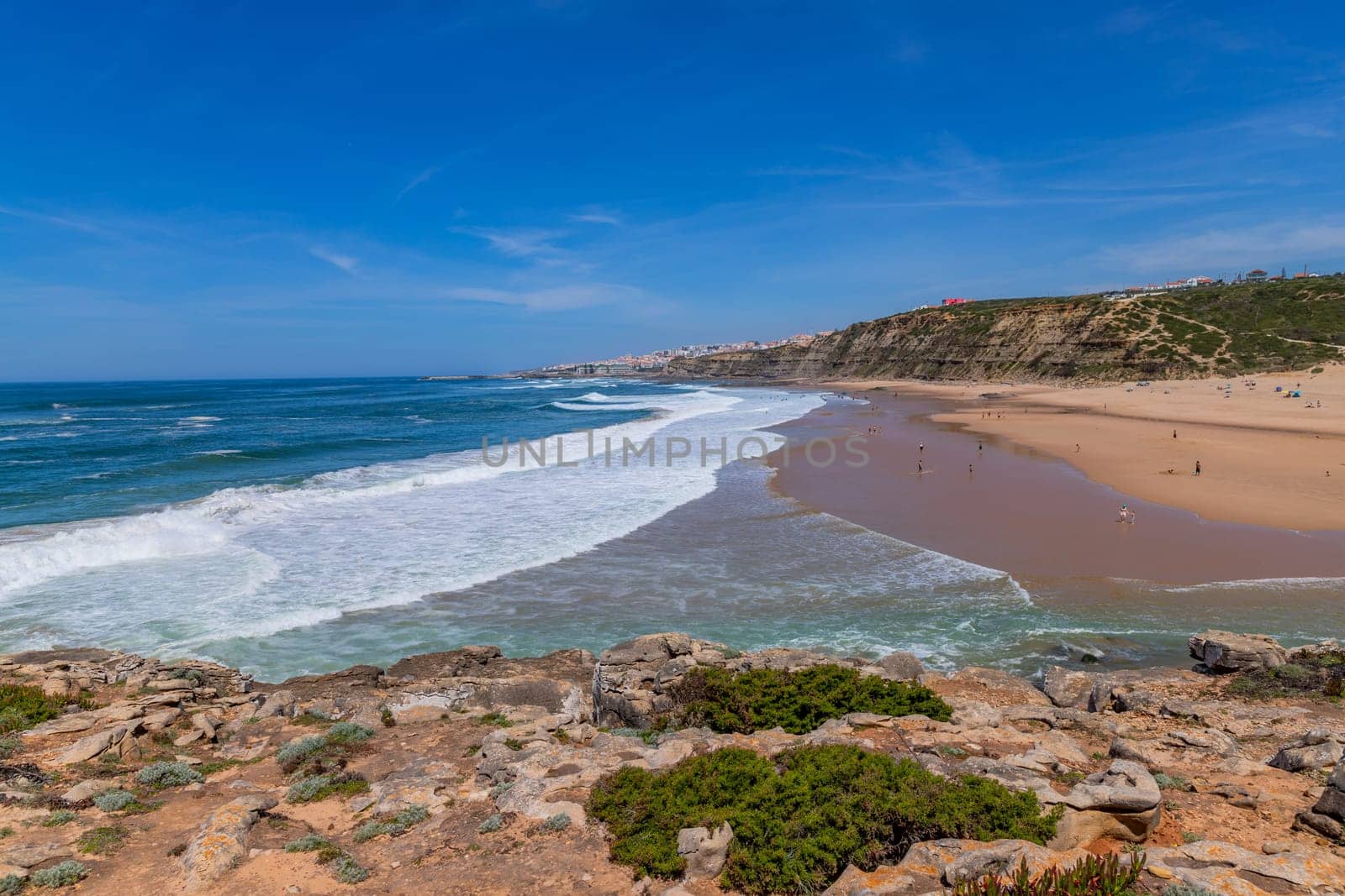 Sintra, Portugal: April 13, 2024: People at the beach of Foz do Lizandro, Ericeira, Portugal