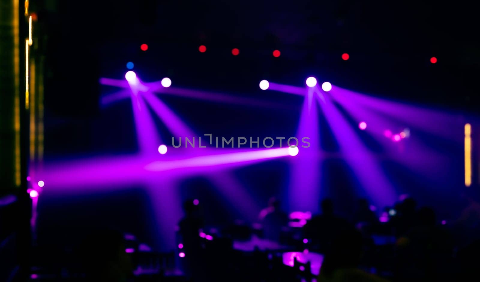 Abstract blurred image background of stage with colorful lights. Party, concert and entertainment concept
