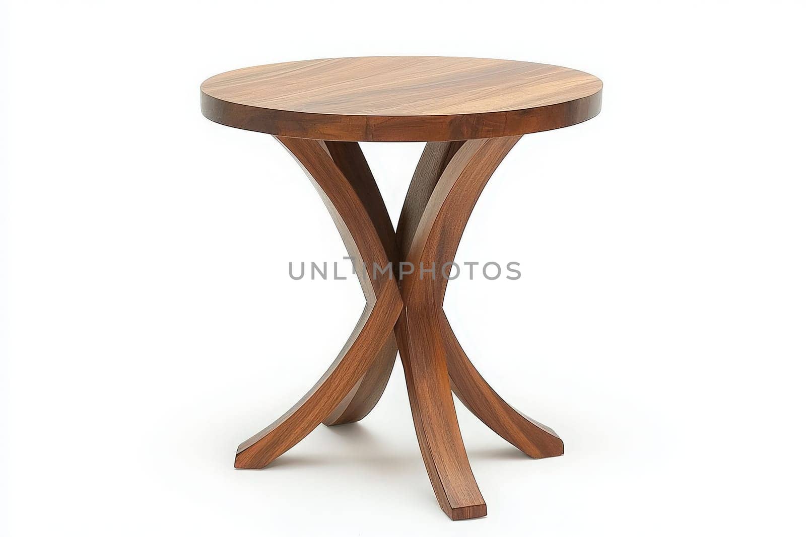This chic side table features a round top and stylish curved legs, highlighting its contemporary craftsmanship. Positioned centrally, it enhances the surrounding decor with its elegant simplicity.