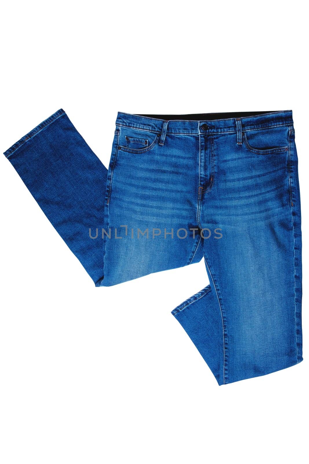 Jeans isolated. Folded trendy stylish blue denim stretch pants or trousers for men isolated on a white background. Clipping path. Jeans summer and autumn fashion.