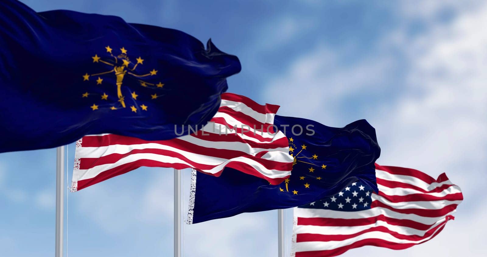 Indiana state flags waving with the national flag of the United states on a clear day. 3d illustration render. Selective focus. Fluttering fabric. Selective focus