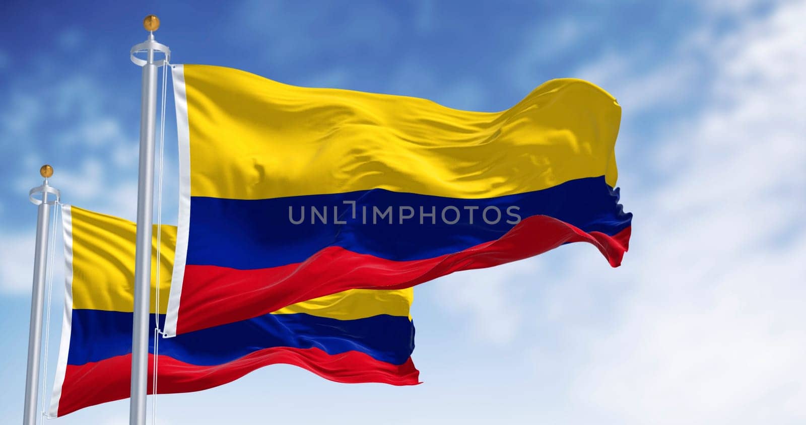 Colombia national flags waving in the wind on a clear day. Horizontal tricolor of yellow, blue, and red. Latin american country. 3d illustration render. Fluttering fabric. Selective focus