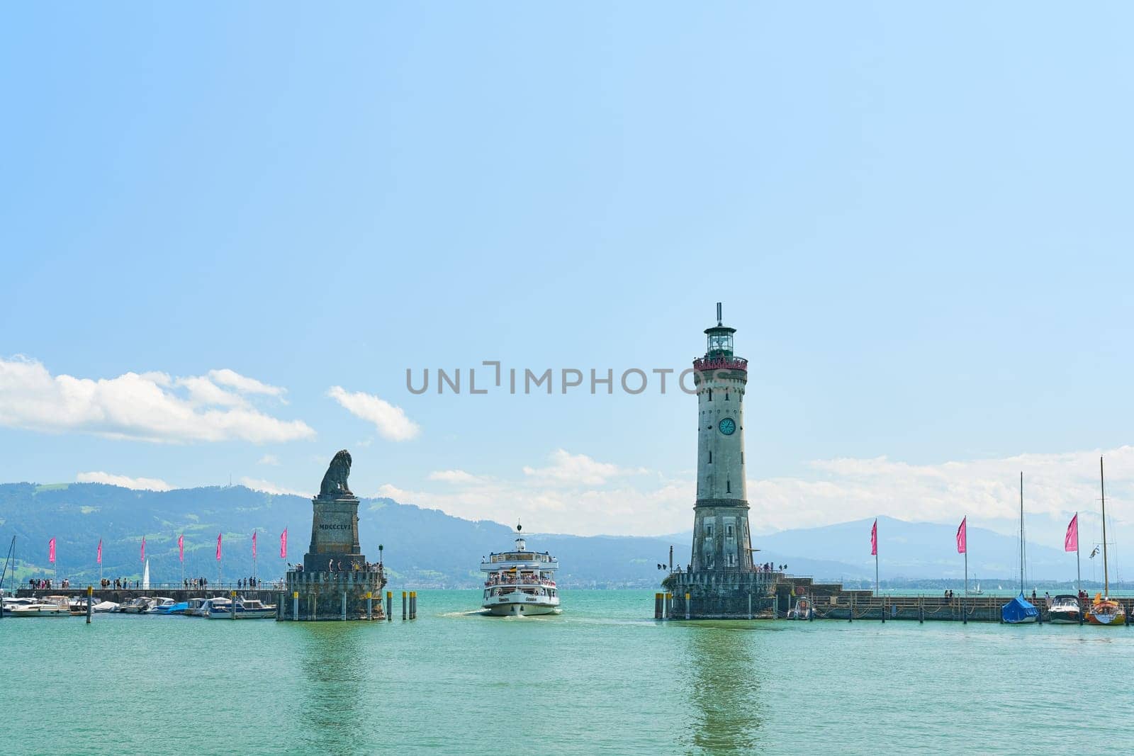 Harbor entrance of Lindau on Lake Constance, Bodensee with an arriving passenger ship