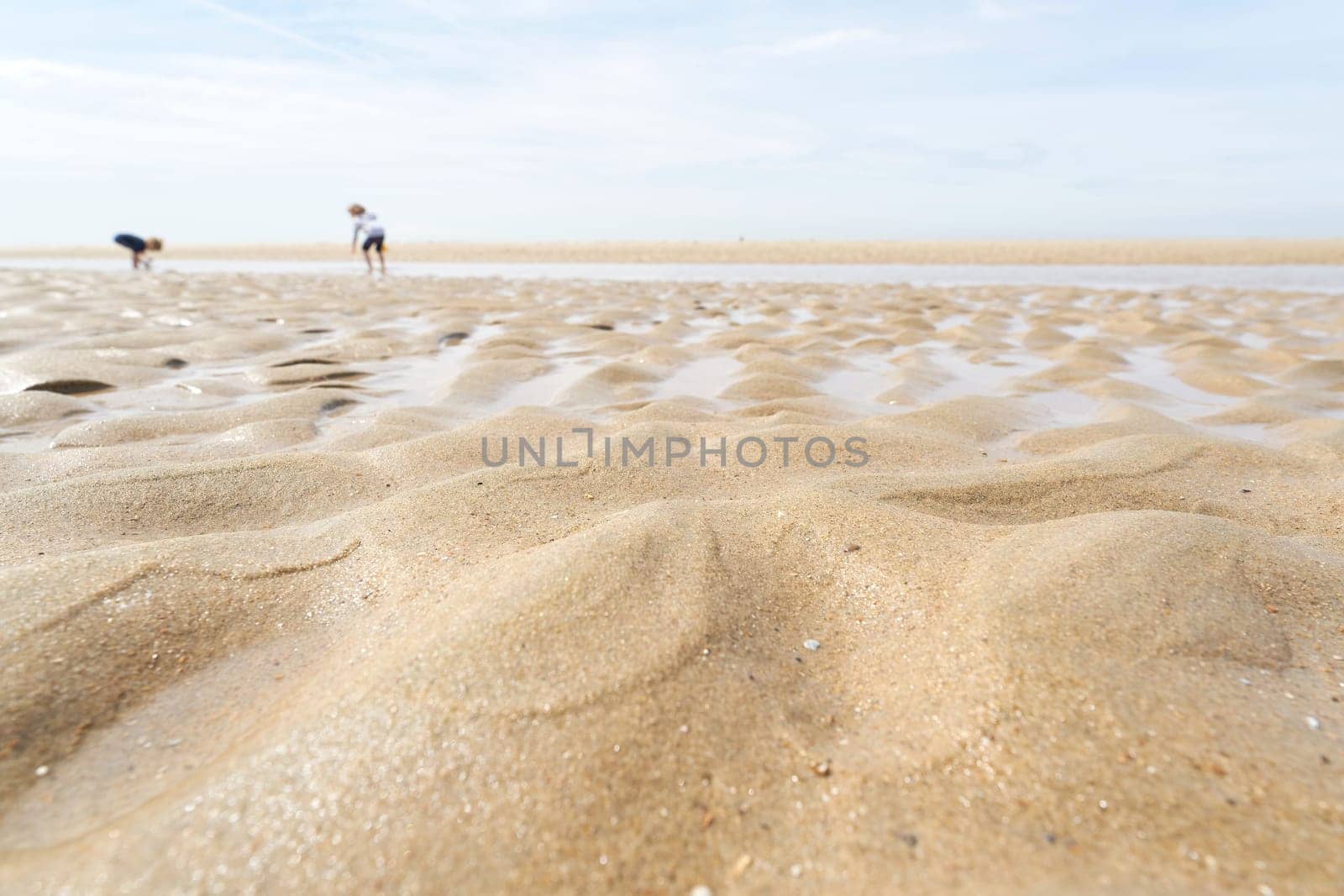 Sand on the beach at De Haan on the Belgian North Sea coast at low tide