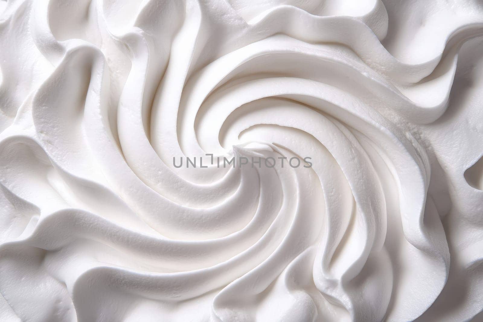 A smooth and clean swirl of whipped cream is artistically arranged on a white background, highlighting the elegant simplicity of minimalist dessert decoration.