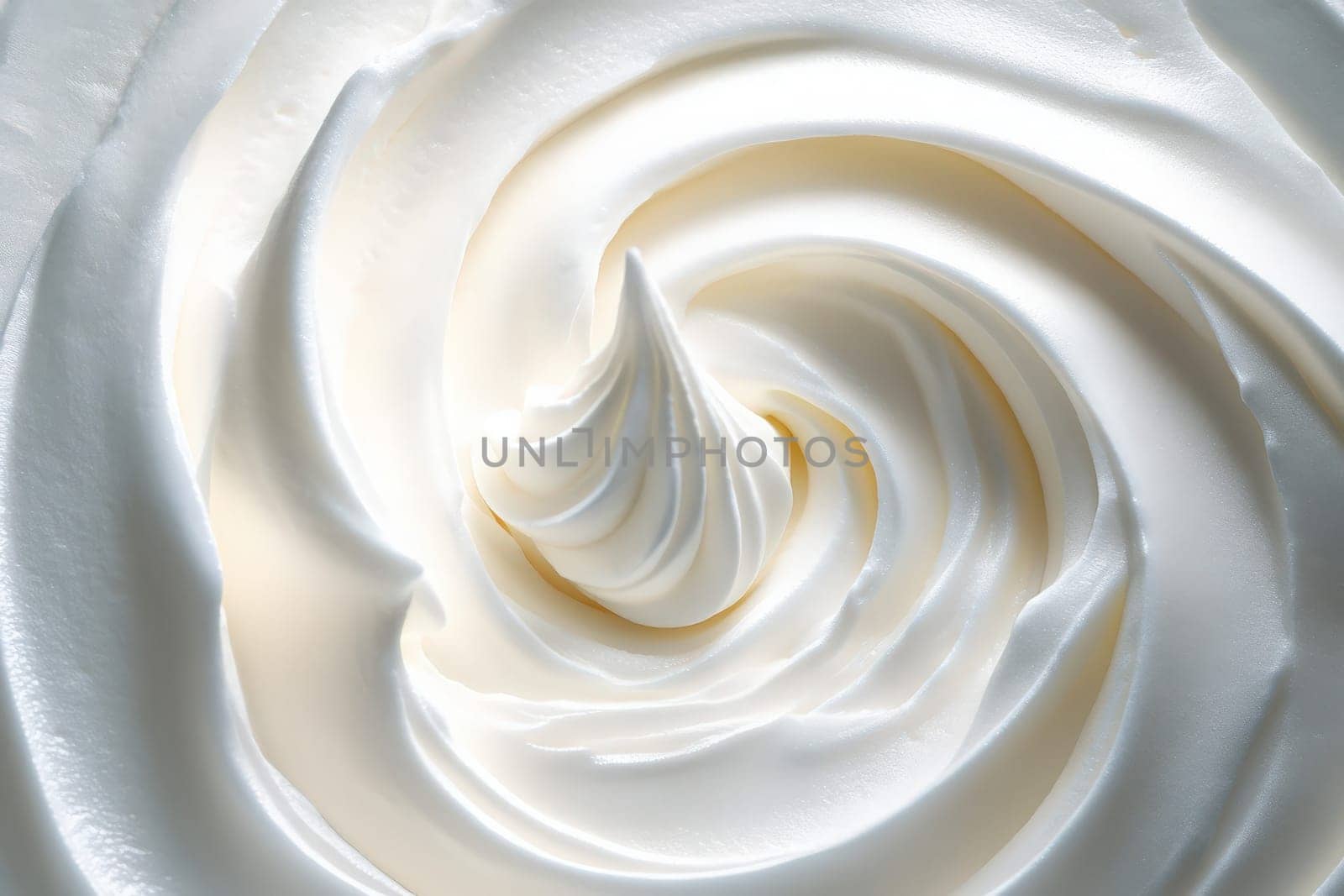 A beautifully crafted whipped cream swirl showcases a clean and minimalist design, highlighting the art of dessert decoration. Its smooth texture and elegant form create a visually appealing treat.