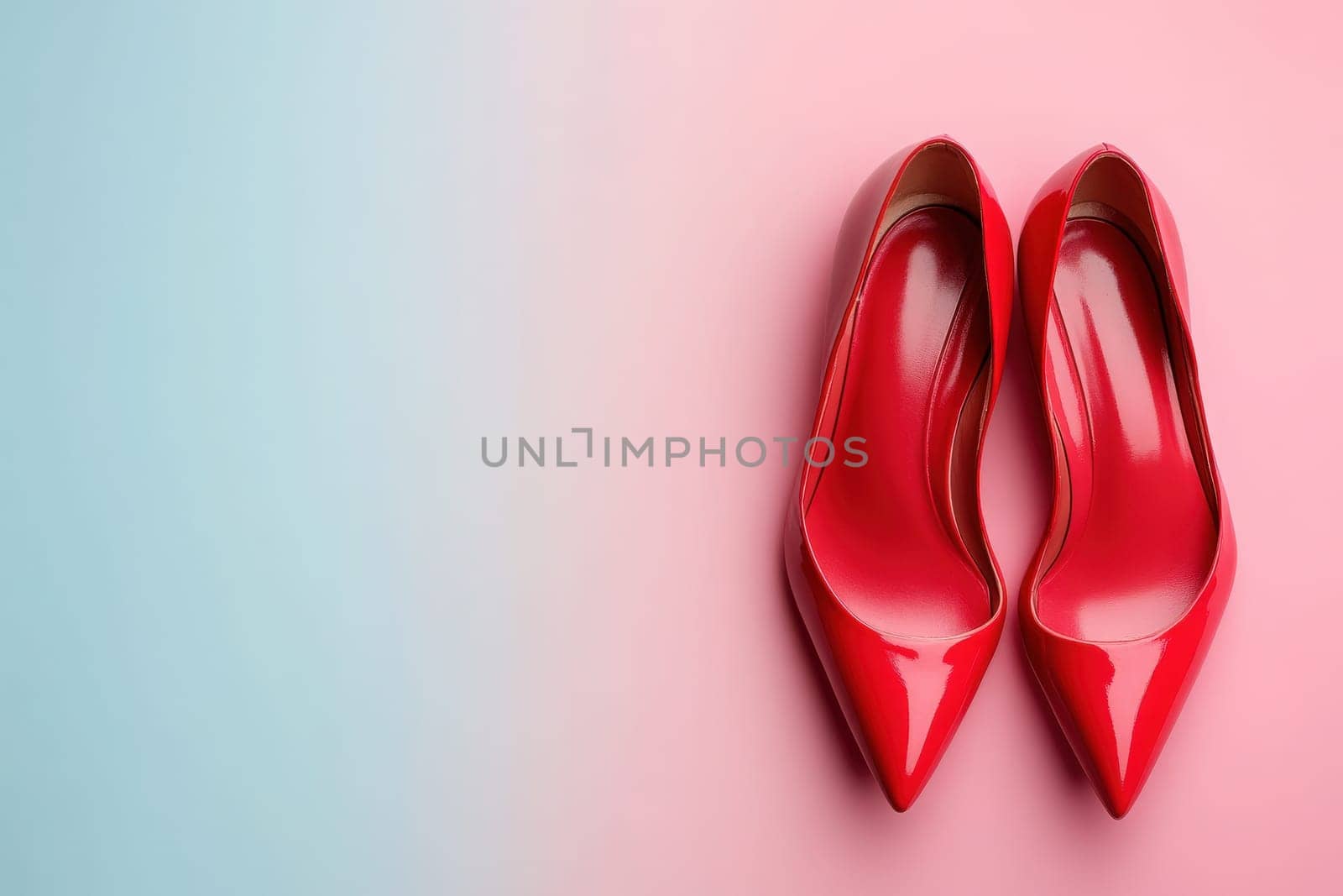 A pair of elegant red classic pumps rests on a soft pastel background, highlighting their sleek design and shiny finish. The shoes embody sophistication and versatility for any occasion.