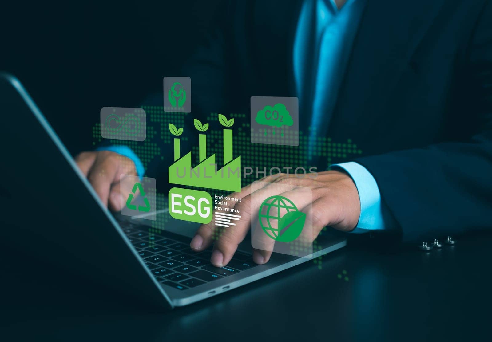 Businessman using laptops to analyze ESG on screen in business investment strategy concept, ESG environment social governance investment business concept, Environmental and business growth together.