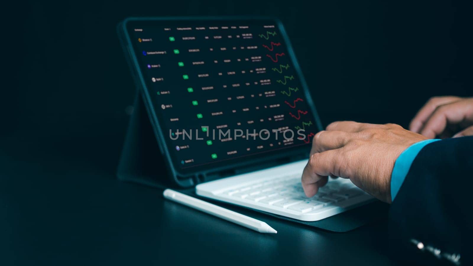 Investors use laptops to analyze stock market, investment strategies. and business growth analysis, investing in companies with long-term competitive advantages, Broker use tablet analysing trading.