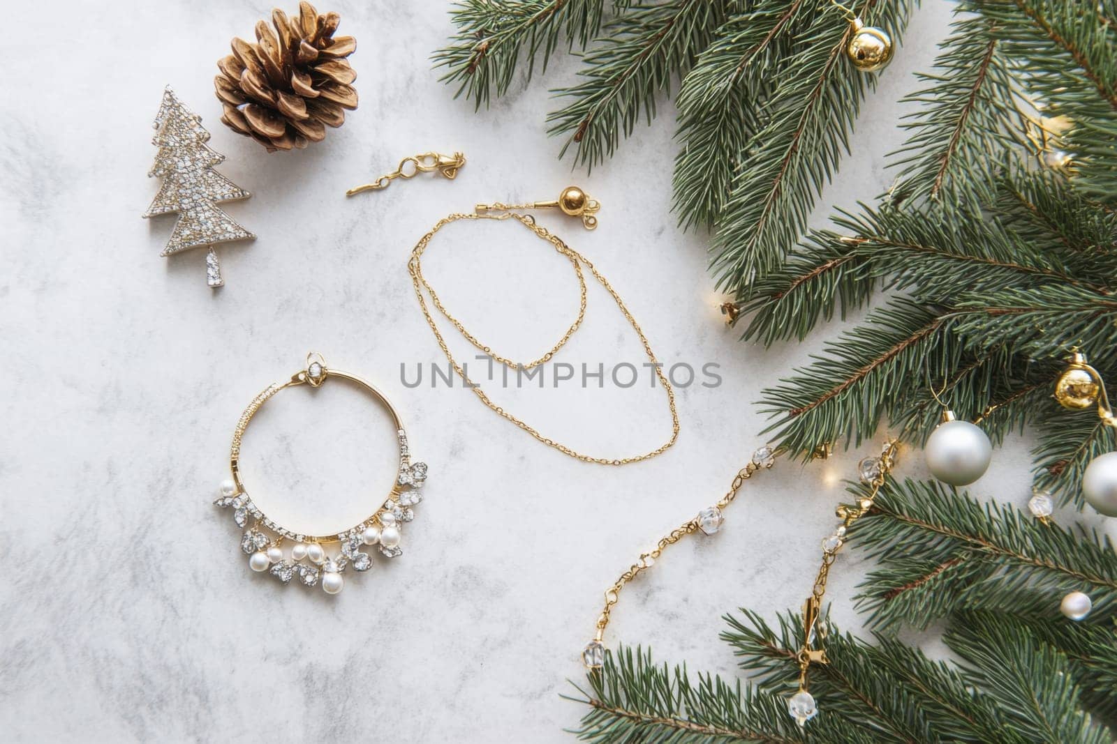 Delicate gold jewelry pieces showcased beside pine branches and festive decor creating a seasonal display perfect for celebrations.