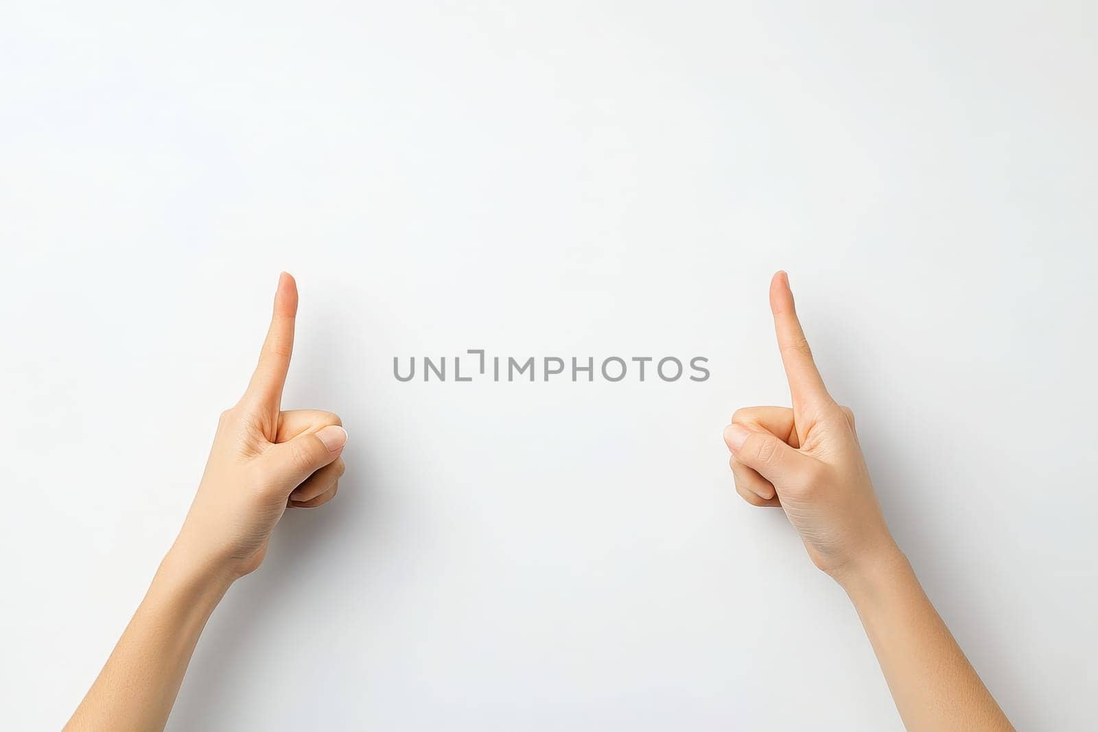 A pair of hands displays crossed fingers against a bright white backdrop, signifying a gesture of hope and good luck. This simple yet powerful symbol evokes positive feelings.