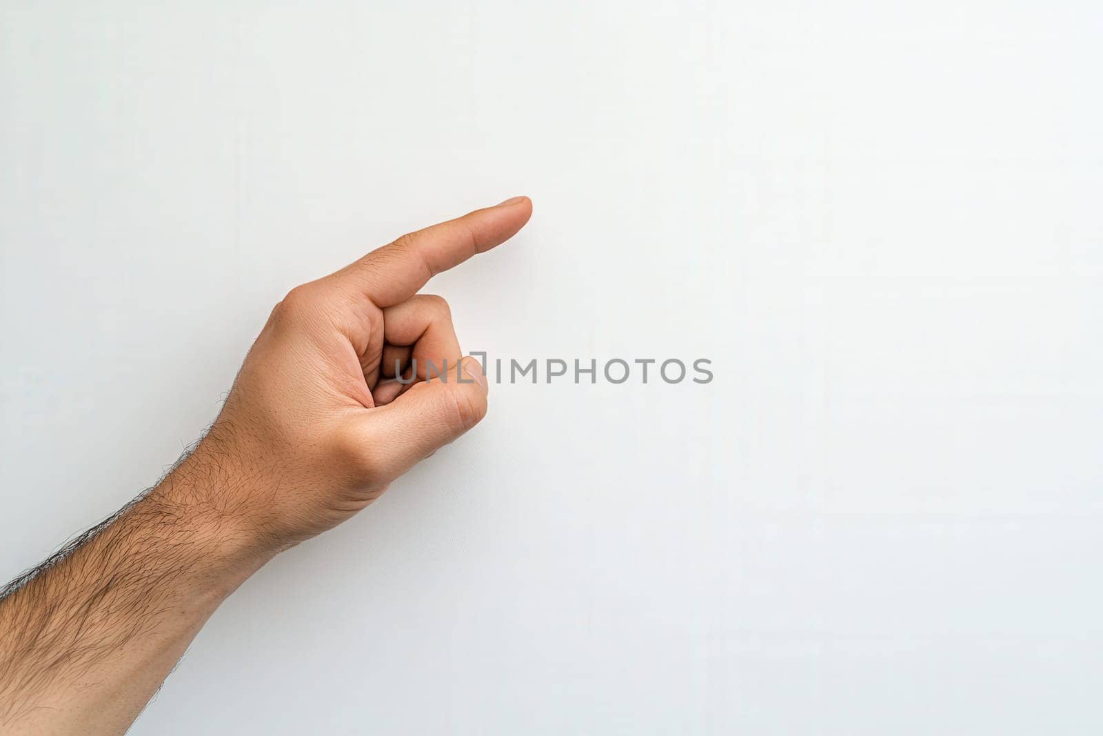 A hand gestures with fingers crossed, set against a solid white background, conveying a hopeful expression. This simple yet powerful pose often symbolizes wishing for good fortune or luck.