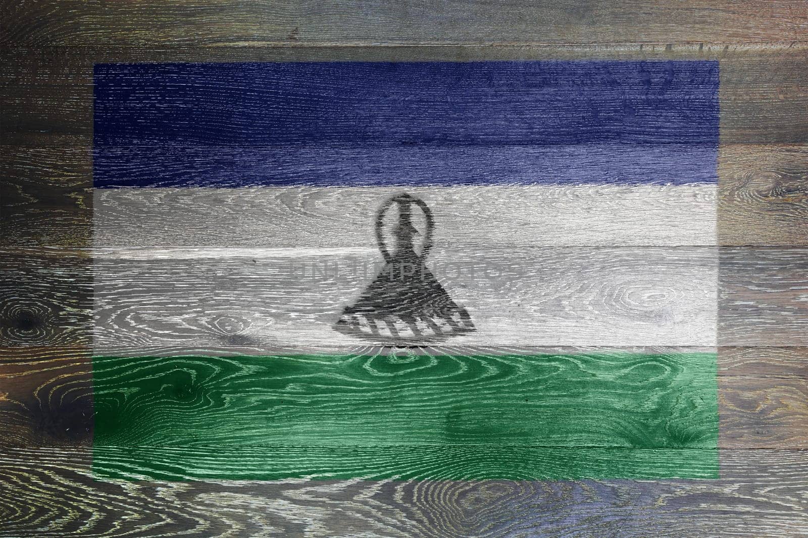 A Lesotho flag on rustic old wood surface background