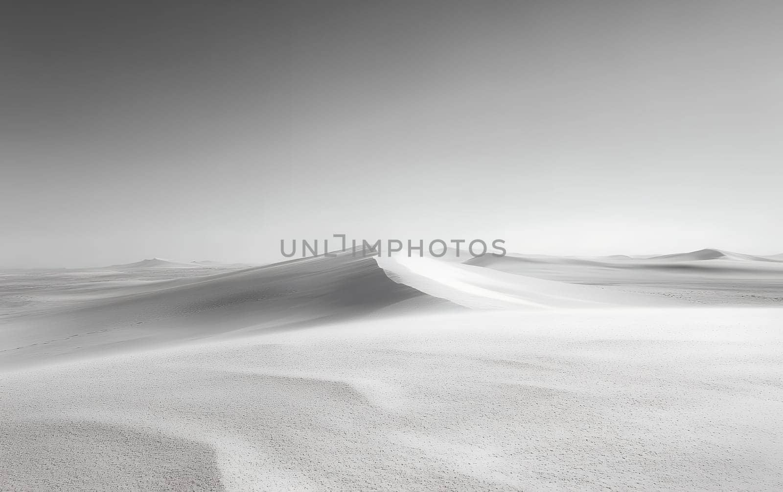 Minimalist black and white desert landscape with smooth sand dunes stretching to the horizon under a stark sky, evoking serenity and isolation.