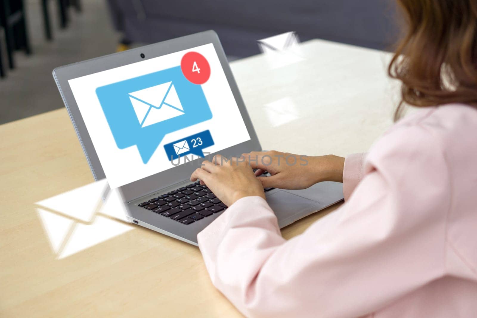 Businesswoman hand typing on laptop computer keyboard, surfing internet on office table with email icon, email marketing concept, send e-mail or news letter, online working internet network.