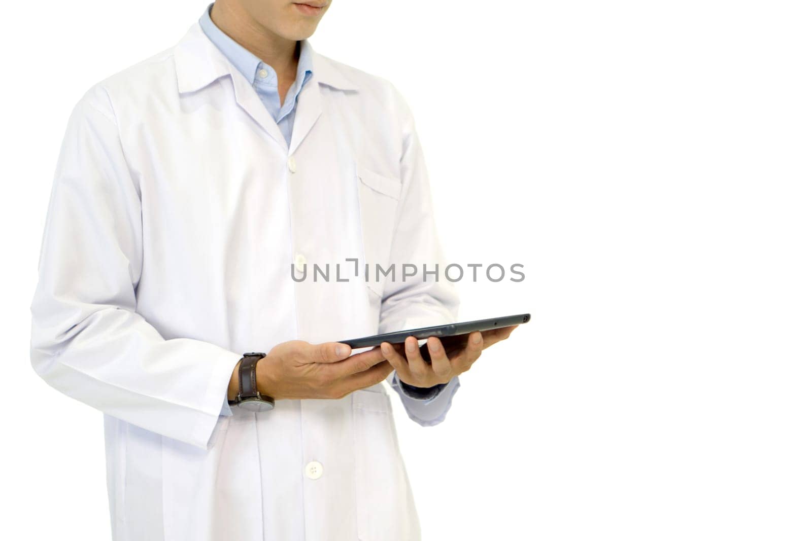 A doctor in a white lab coat holding tablet computer with his hand. Portrait on white background, studio shot.