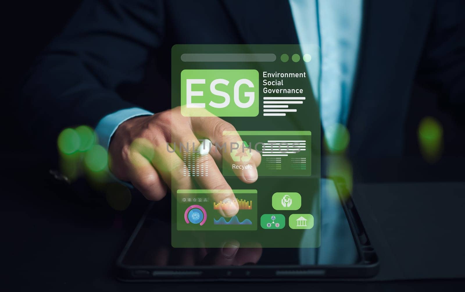Man hand using stylus pen to analyze ESG on screen in business investment strategy concept, ESG environment social governance investment business concept, Environmental and business growth together.