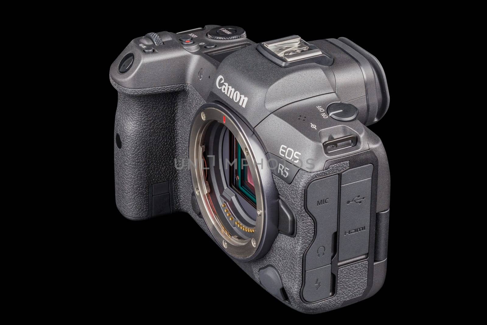 Canon R5 - black professional 35mm full-frame mirrorless camera body with flip screen isolated on black background with focus stacking - Tula, Russia, September 15, 2021