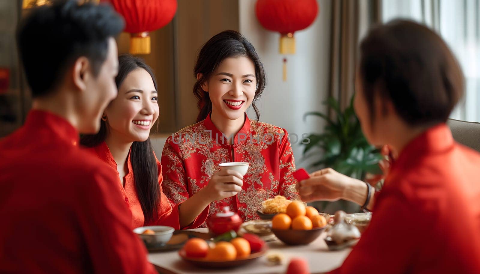 Family celebrating Chinese Happy New Year festival at table at home, restaurant. Neatly hung illuminated paper red lanterns. Happiness, luck and prosper. Banner, postcard, greeting card. Tangerines
