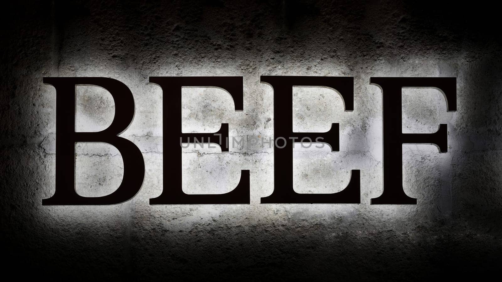 illuminated lettering Beef as a reference to a steakhouse on the facade of a building