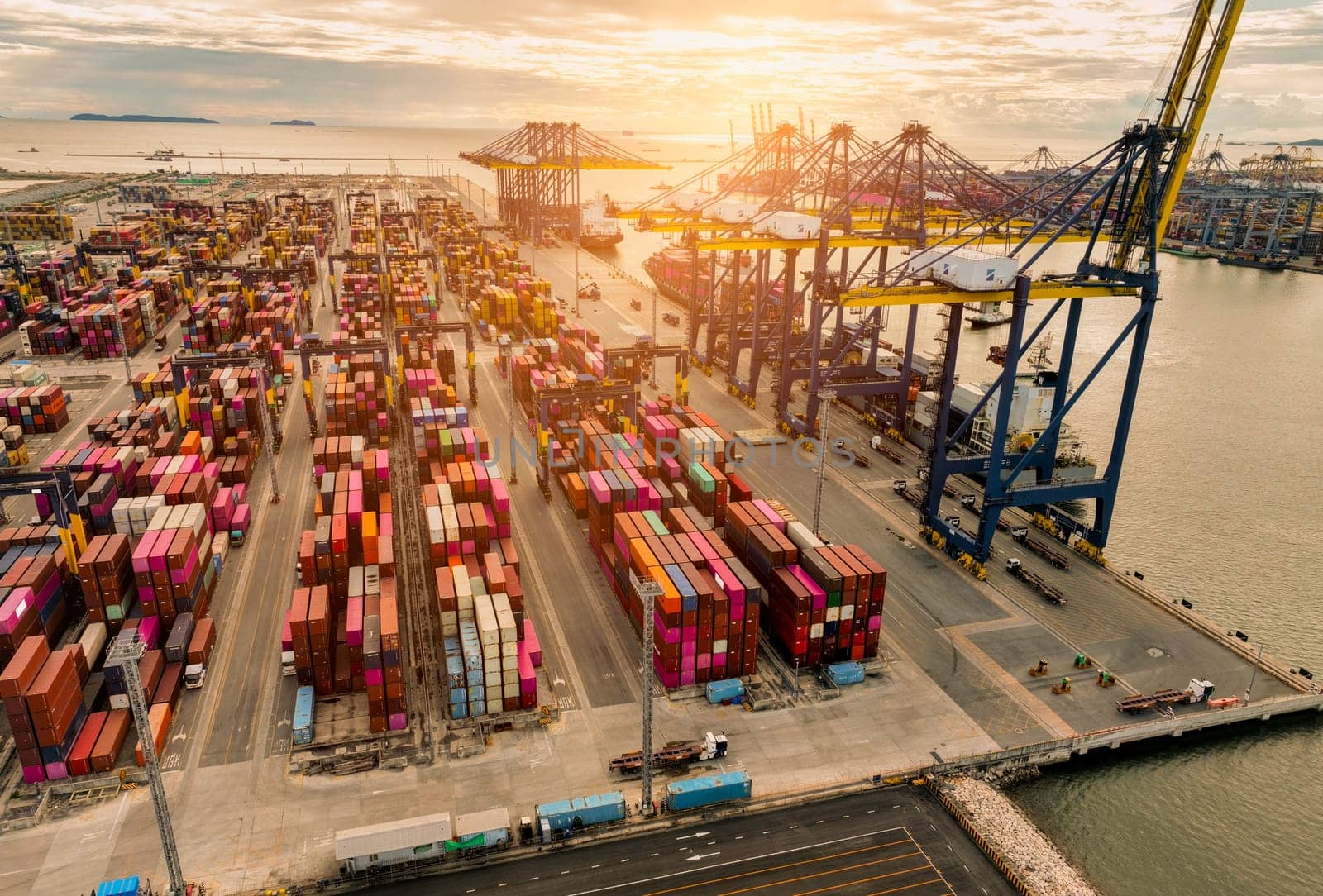 Logistics and transportation of container cargo ship at ship port. Container truck and crane bridge in shipyard. Import export and transport industry. Terminal port for export transport by ship.