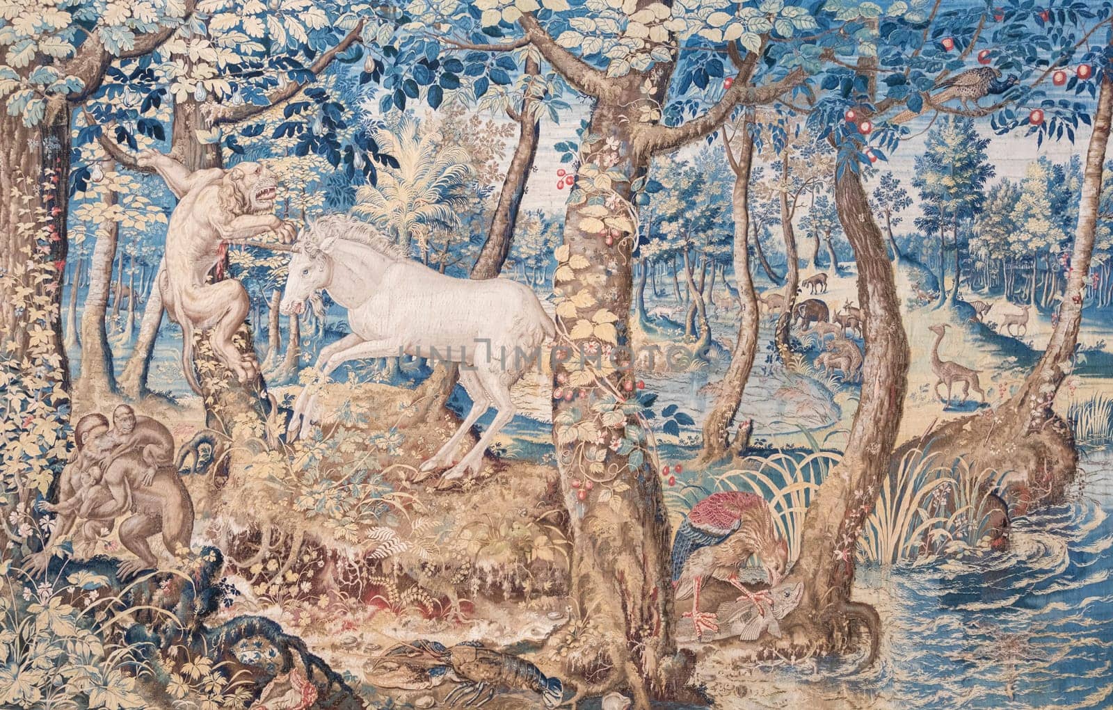 Isola Bella, Italy - 1 August 2023: detail of antique Italian tapestry in Borromeo Palace. Ancient decoration on indoor walls, fantasy creature
