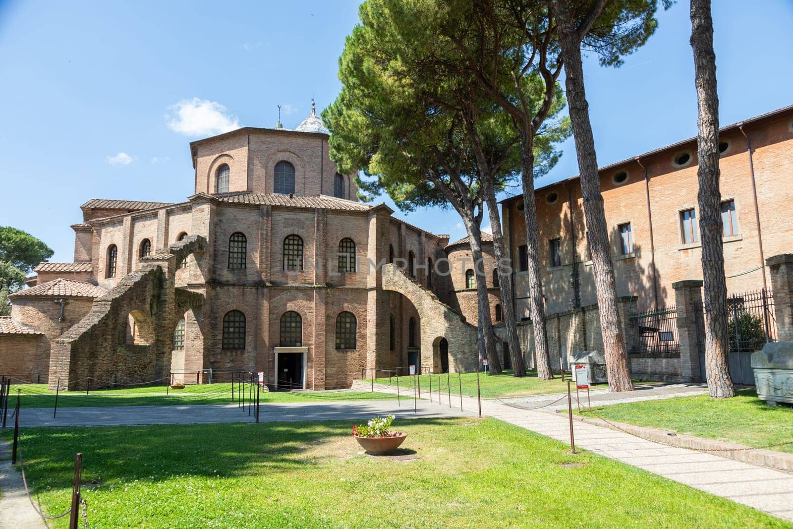 RAVENNA, ITALY - JUNE 12, 2024: San Vitale Basilica, famous for the ancient mosaics, exterior with blue sky