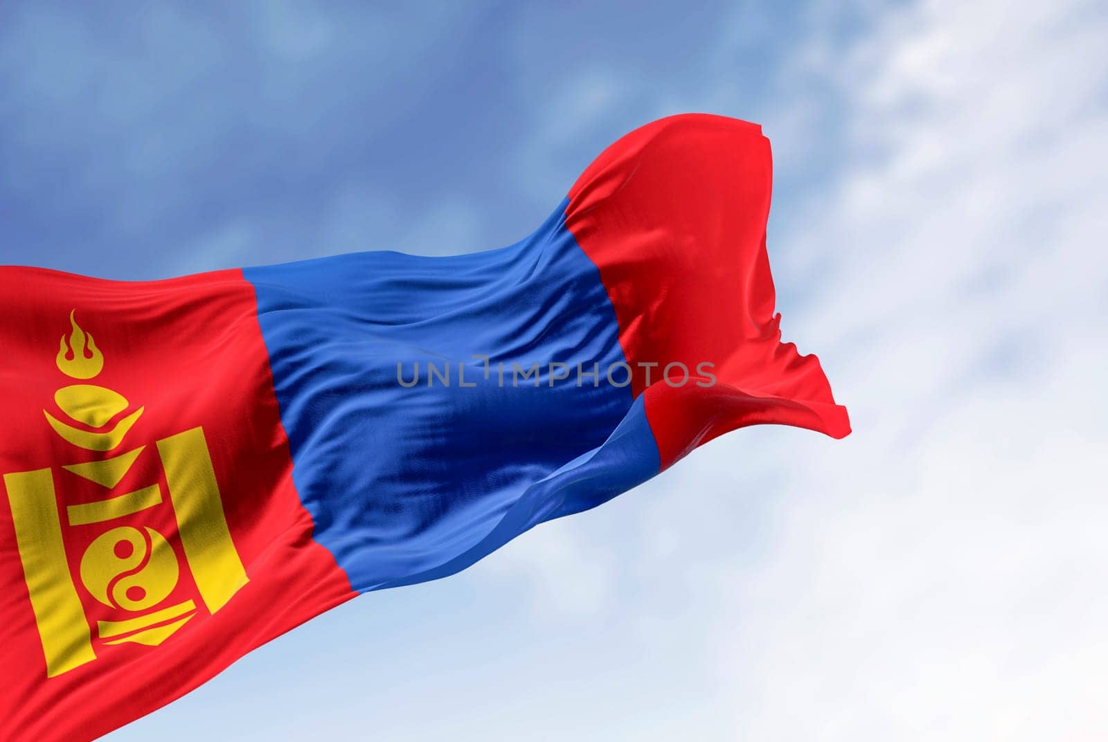 Mongolia national flag waving in the wind on a clear da. Red, blue, red stripes, yellow Soyombo on left red. 3d illustration render. Rippling fabric. Selective focus