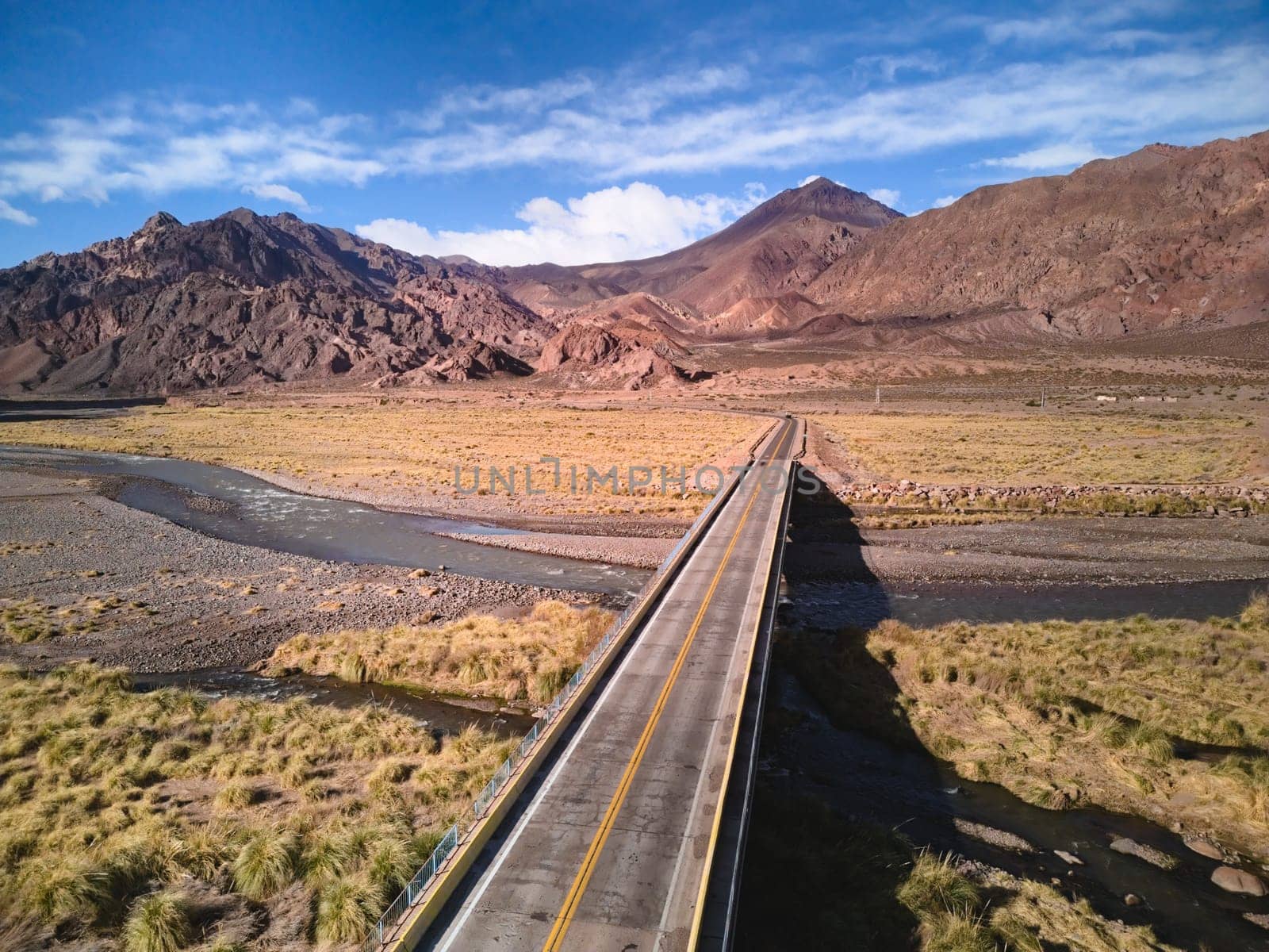 Bridge across Mendoza River by the Andes mountains near Uspallata, Argentina.