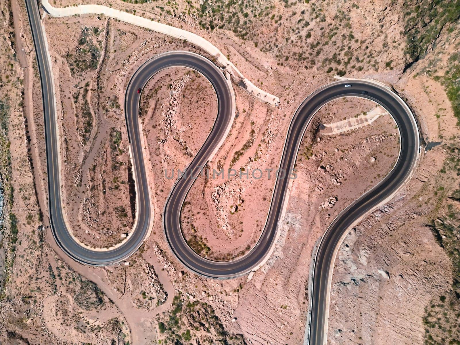 Twisty mountain road across the the Andes mountains near Potrerillos, Argentina. Aerial view.