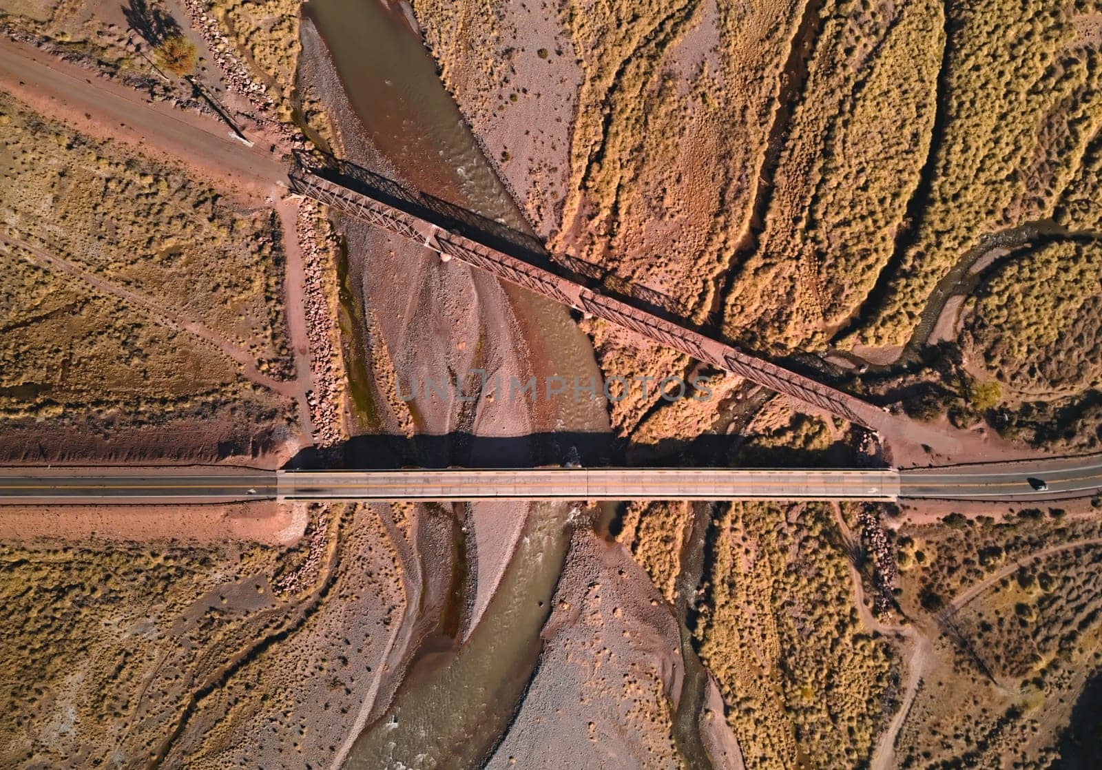 Bridge across Mendoza River by the Andes mountains near Uspallata, Argentina. Aerial view.
