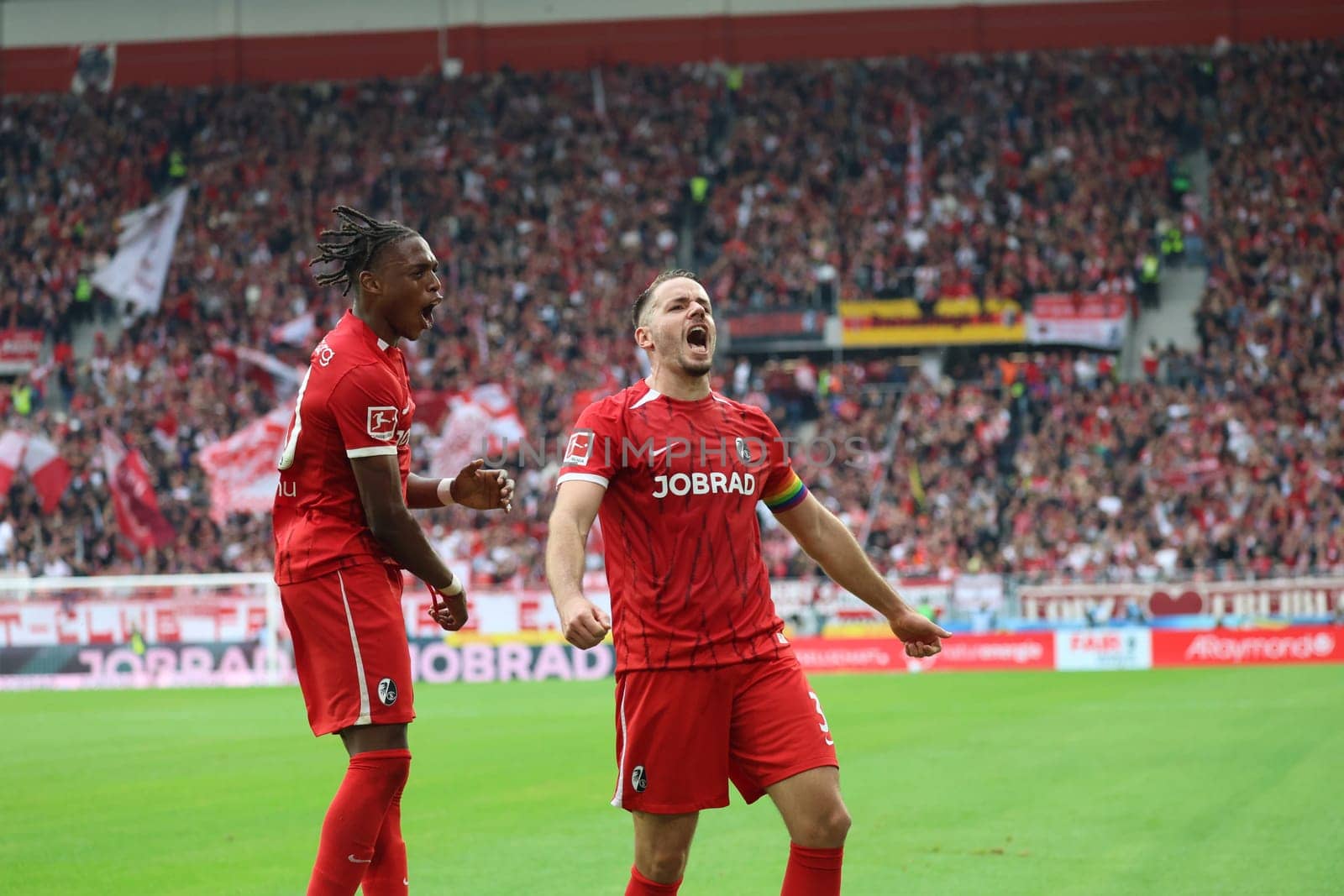 Christian Günter (SC Freiburg) celebrates with Junior Adamu (SC Freiburg) his goal to make it 3-0 at half-time in the match of the 1st FBL: 24-25: 1st FBL: 24-25: 7th Sptg. SC Freiburg - FC Augsburg  DFL REGULATIONS PROHIBIT ANY USE OF PHOTOGRAPHS AS IMAGE SEQUENCES AND/OR QUASI-VIDEONann  Photo: Joachim Hahne/johapress