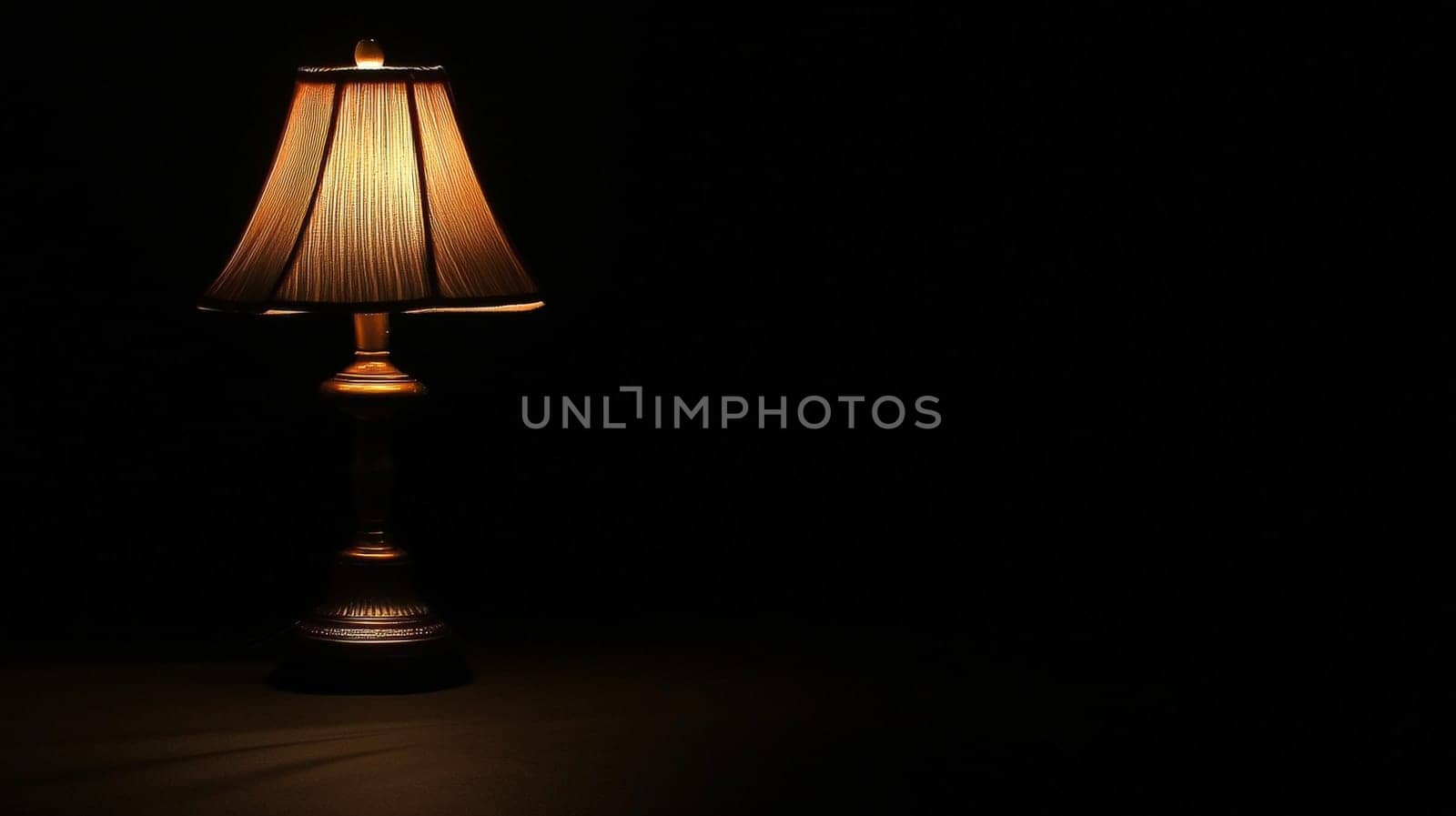 A minimalist image featuring a completely dark black background, illuminated only by a solitary light from a lamp. The striking contrast between light and shadow creates a dramatic and contemplative atmosphere, evoking feelings of solitude, focus, and serenity.