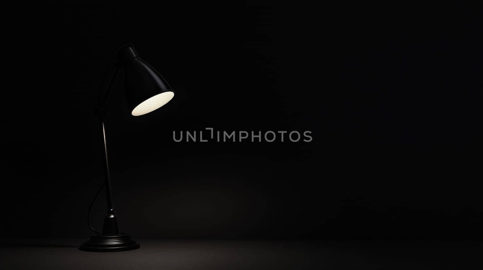 A minimalist image featuring a completely dark black background, illuminated only by a solitary light from a lamp. The striking contrast between light and shadow creates a dramatic and contemplative atmosphere, evoking feelings of solitude, focus, and serenity.