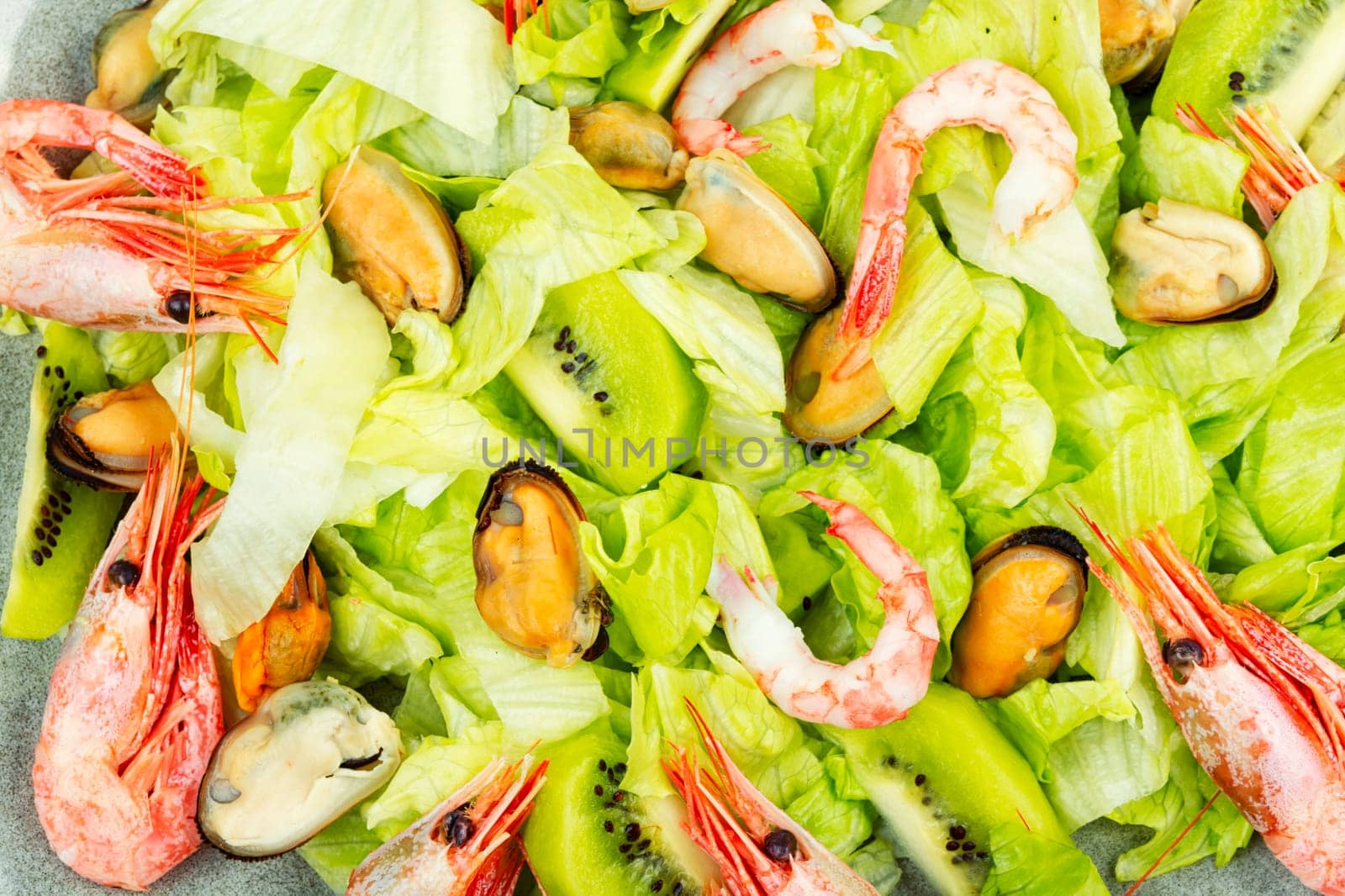 Homemade seafood salad with mussels and shrimps. Food background