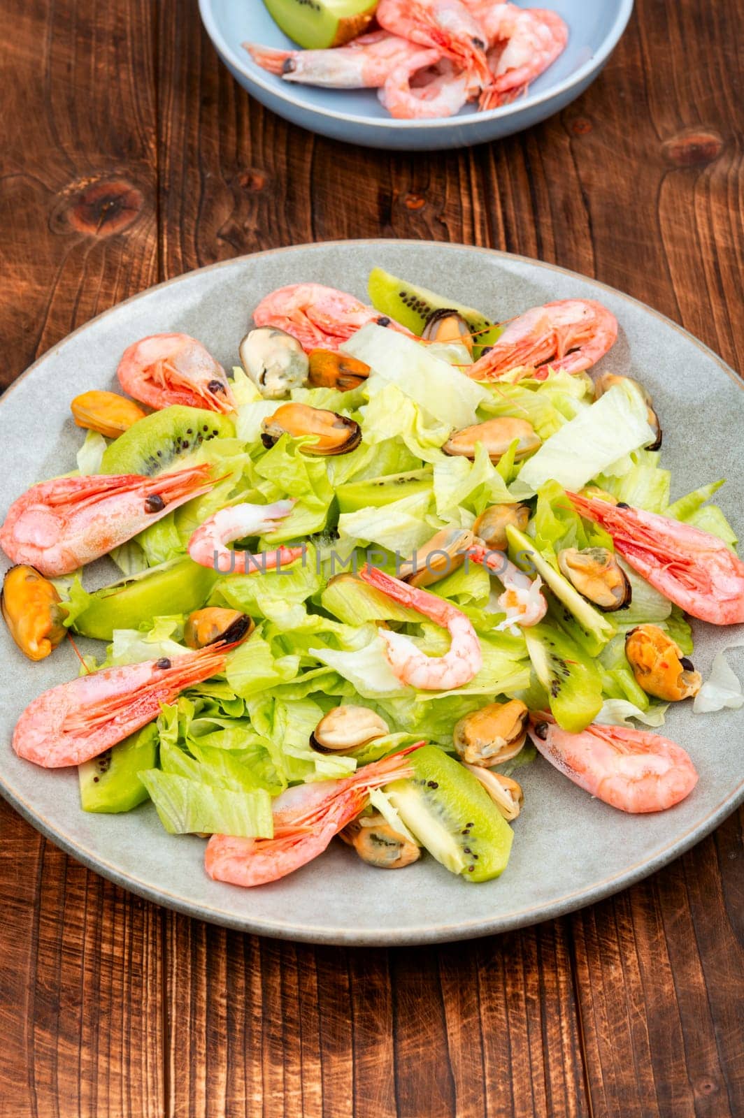 Homemade seafood salad with mussels and shrimps. Food background