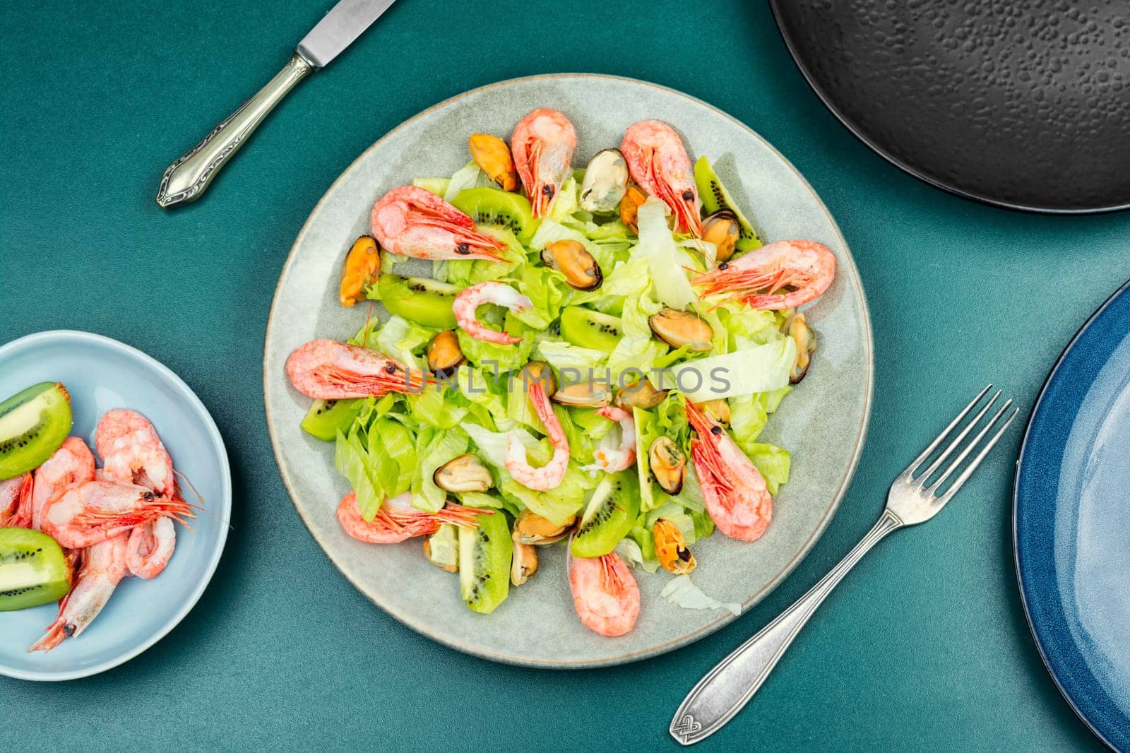 Homemade seafood salad with mussels and shrimps. Food background