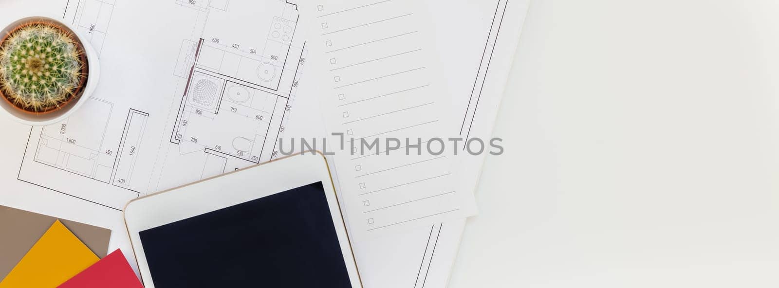 Creative flat lay long wide banner top view blueprints architectural flat project plan office supplies decorator white table workspace with swatches tools and equipment background copy space concept