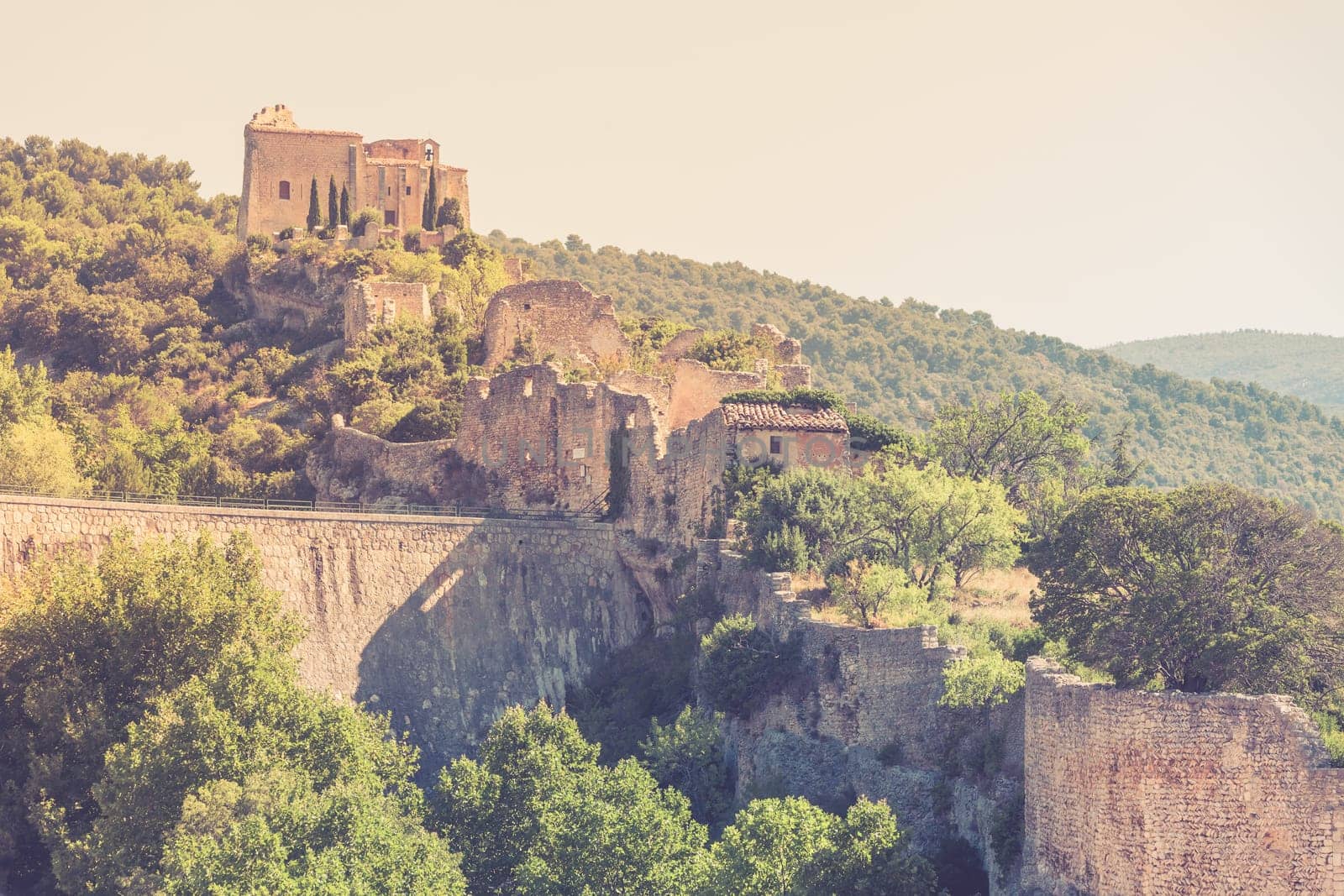 View of Saint Saturnin les Apt, Provence, France. Castle ruins on a hill above the village
