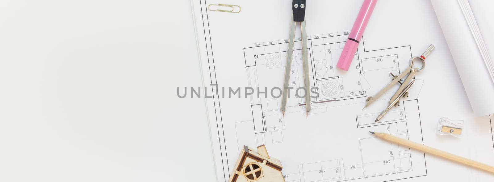 Creative flat lay long wide banner top view blueprints architectural flat project plan office supplies decorator white table workspace with swatches tools and equipment background copy space concept