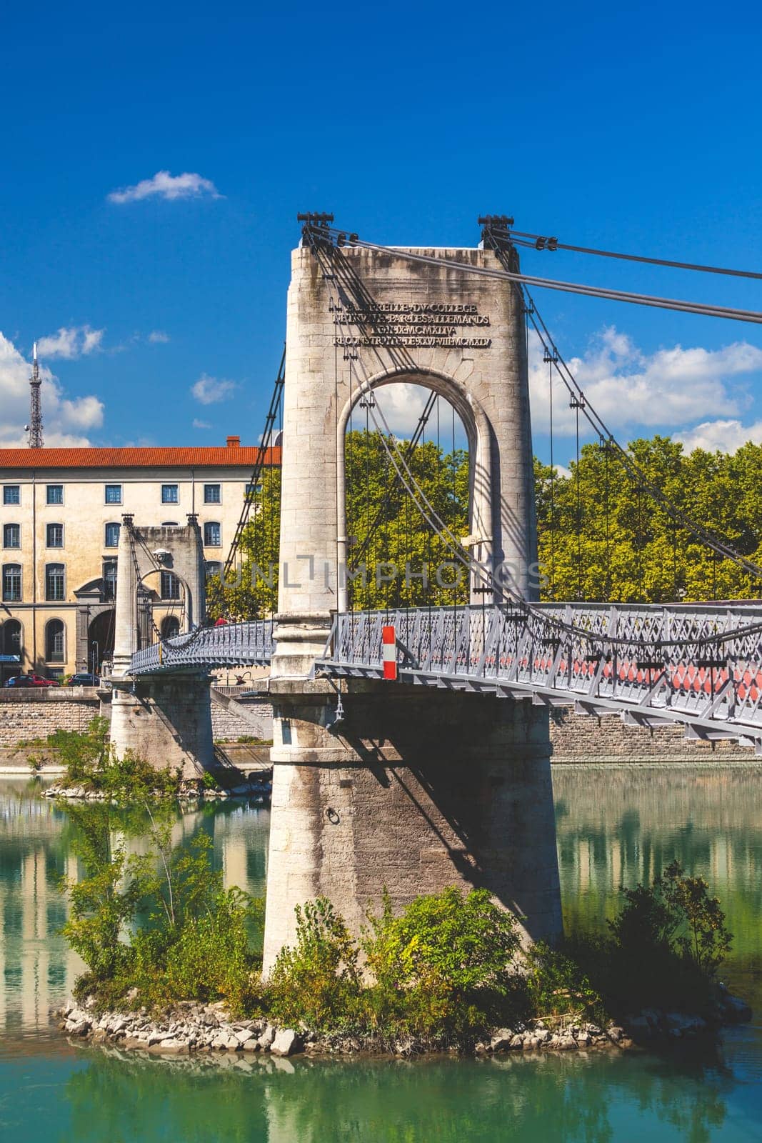 Old Passerelle du College bridge over Rhone river in Lyon, France. Summer day