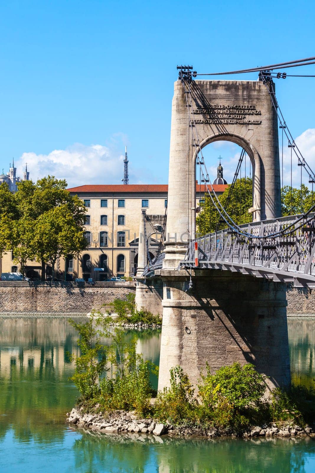 Old Passerelle du College bridge over Rhone river in Lyon, France. Summer day